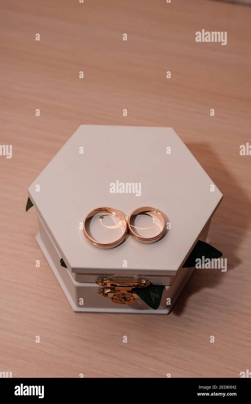 Wedding gold rings on white box Stock Photo