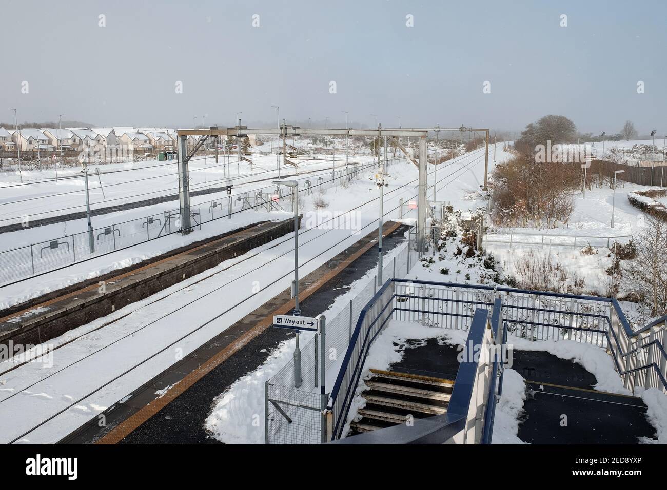 Railway station in winter with snow in Armadale, West Lothian, Scotland. FEBRUARY 10, 2021 Stock Photo