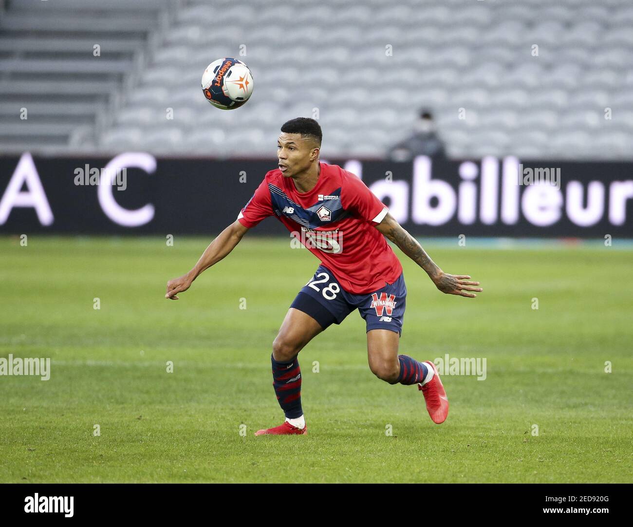 Reinildo Mandava of Lille during the French championship Ligue 1 football match between Lille OSC (LOSC) and Stade Brestois 29 (Brest) on February 14, 2021 at Stade Pierre Mauroy in Villeneuve-d&#039;Ascq near Lille, France - Photo Jean Catuffe / DPPI / LM Stock Photo