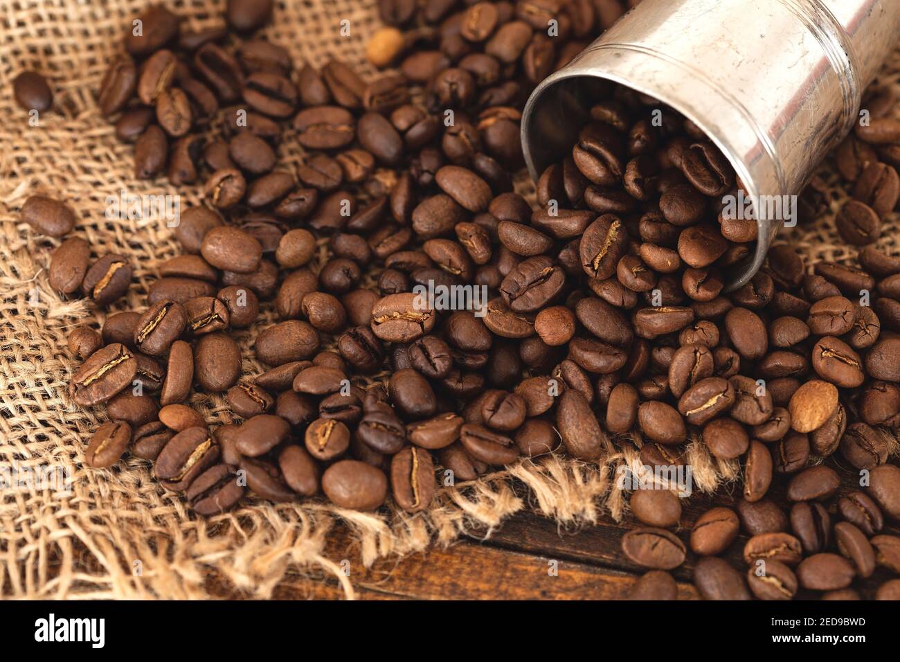 Coffee beans on burlap background Stock Photo