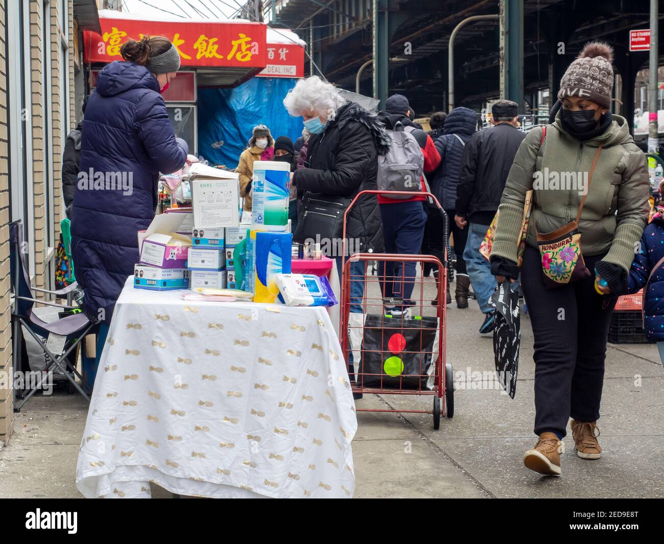 Brooklyn NY, USA - February 14, 2021: Street vendors, some of them illegal, overtaking streets of Bensonhurst trying to survive during pandemic time. Stock Photo