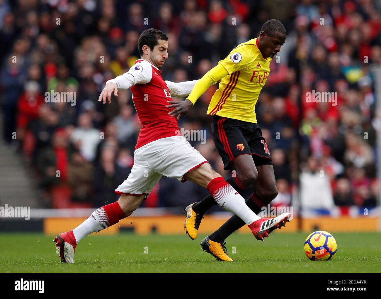 Soccer Football - Premier League - Arsenal vs Watford - Emirates Stadium, London, Britain - March 11, 2018 Arsenal's Henrikh Mkhitaryan in action with Watford's Abdoulaye Doucoure REUTERS/Eddie Keogh EDITORIAL USE ONLY. No use with unauthorized audio, video, data, fixture lists, club/league logos or "live" services. Online in-match use limited to 75 images, no video emulation. No use in betting, games or single club/league/player publications. Please contact your account representative for further details. Stock Photo
