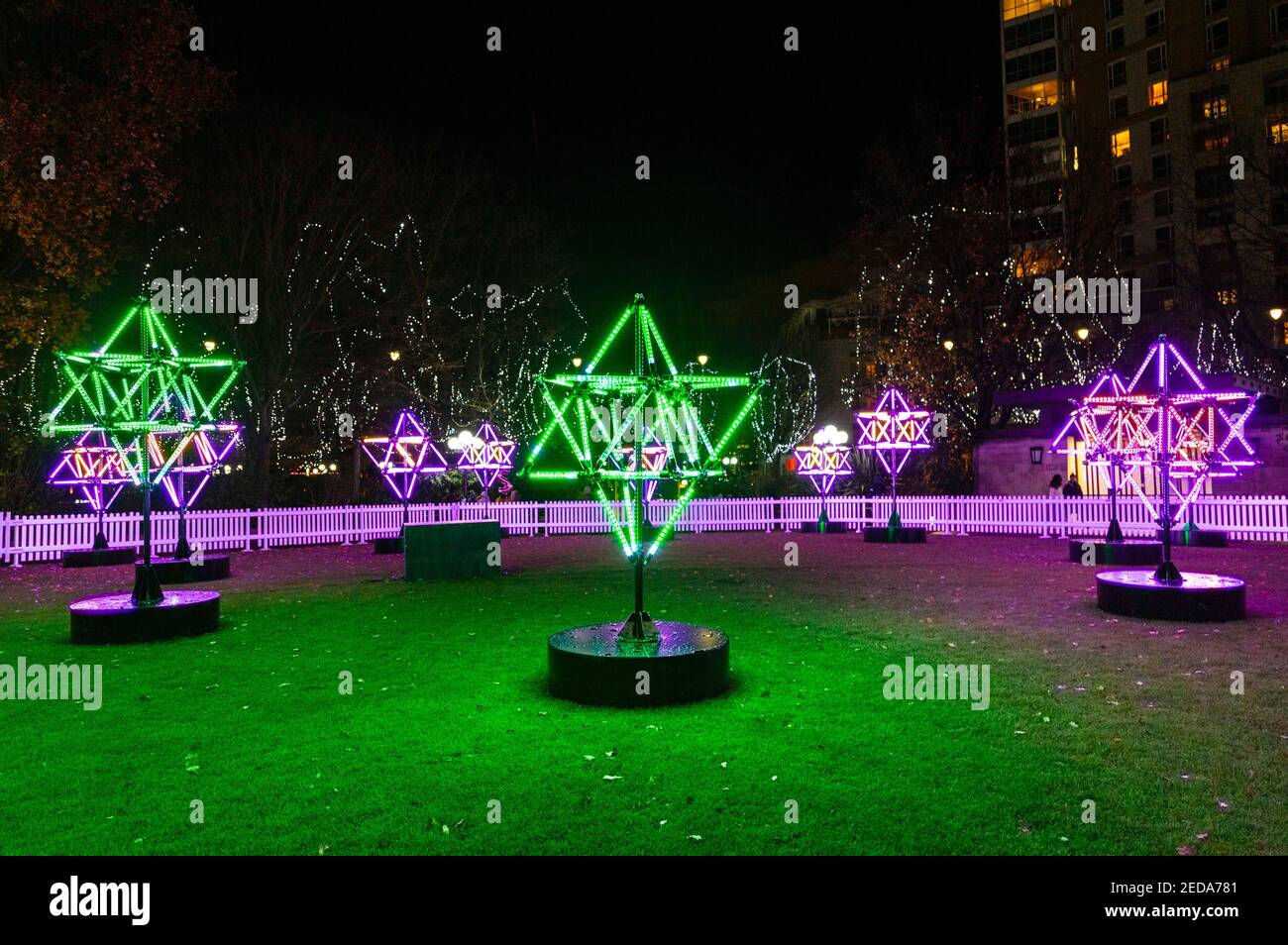5 December 2020 - London, UK, Connected by Light curated light art installations on display, Tetra Park by Mandylights in Canary Wharf Stock Photo
