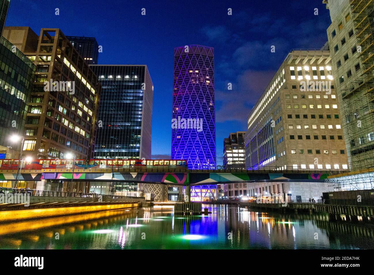 5 December 2020 - London, UK, View over Middle Dock in Canary Wharf, Connected by Light curated light art installations on display, Ghost Trees by Tom Stock Photo