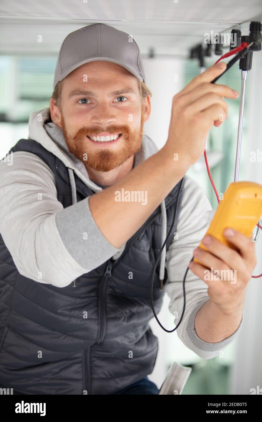 male technician doing meter reading using tablet Stock Photo
