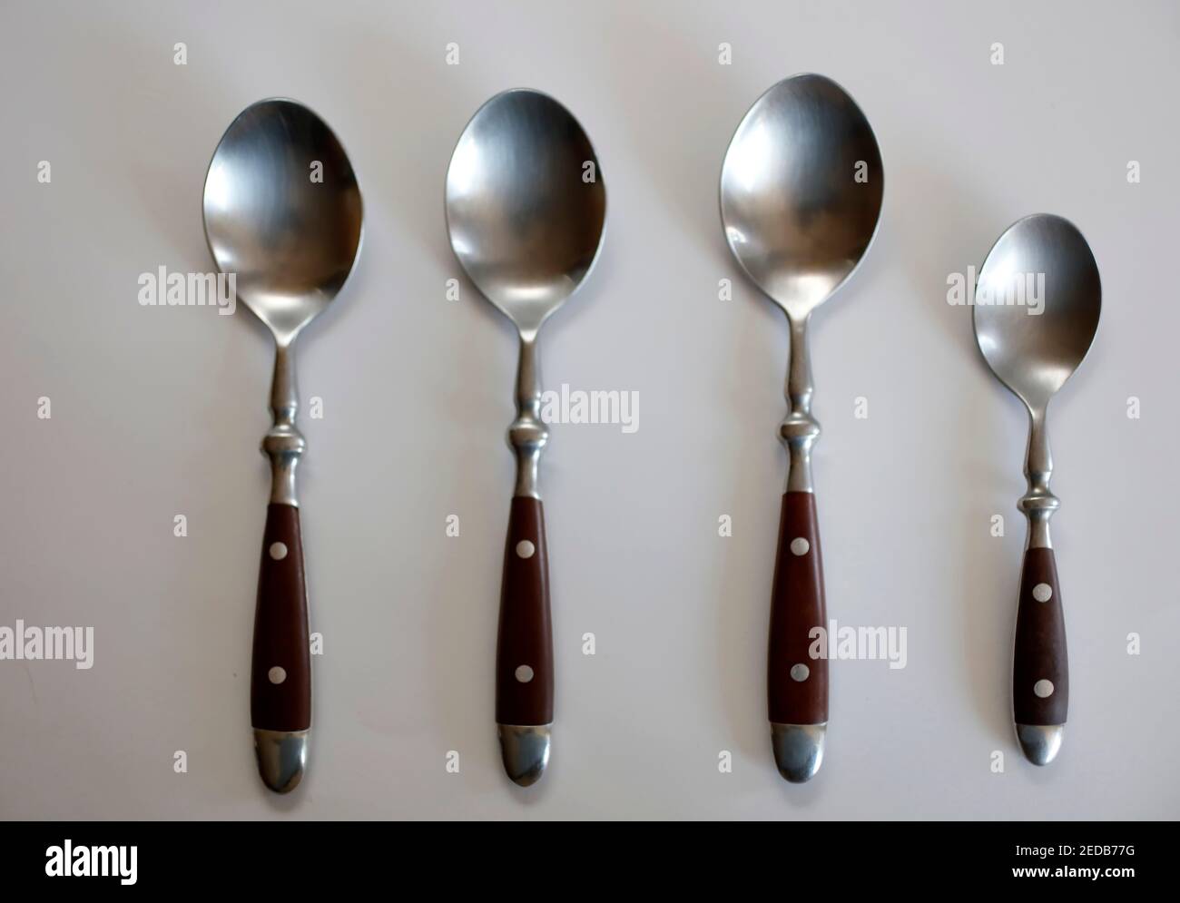 Spoons odd-one-out Stock Photo