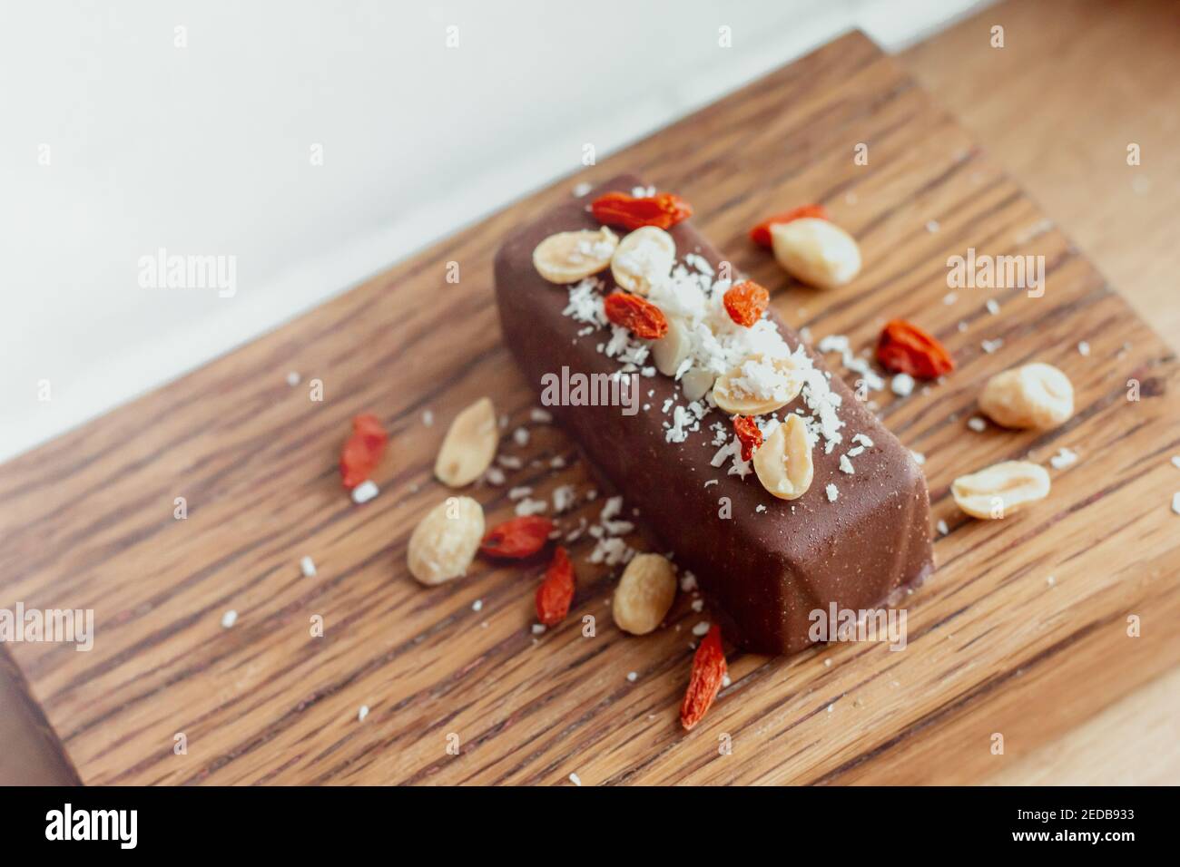 Vegan, gluten free carob chocolate bar with peanuts, goji berries