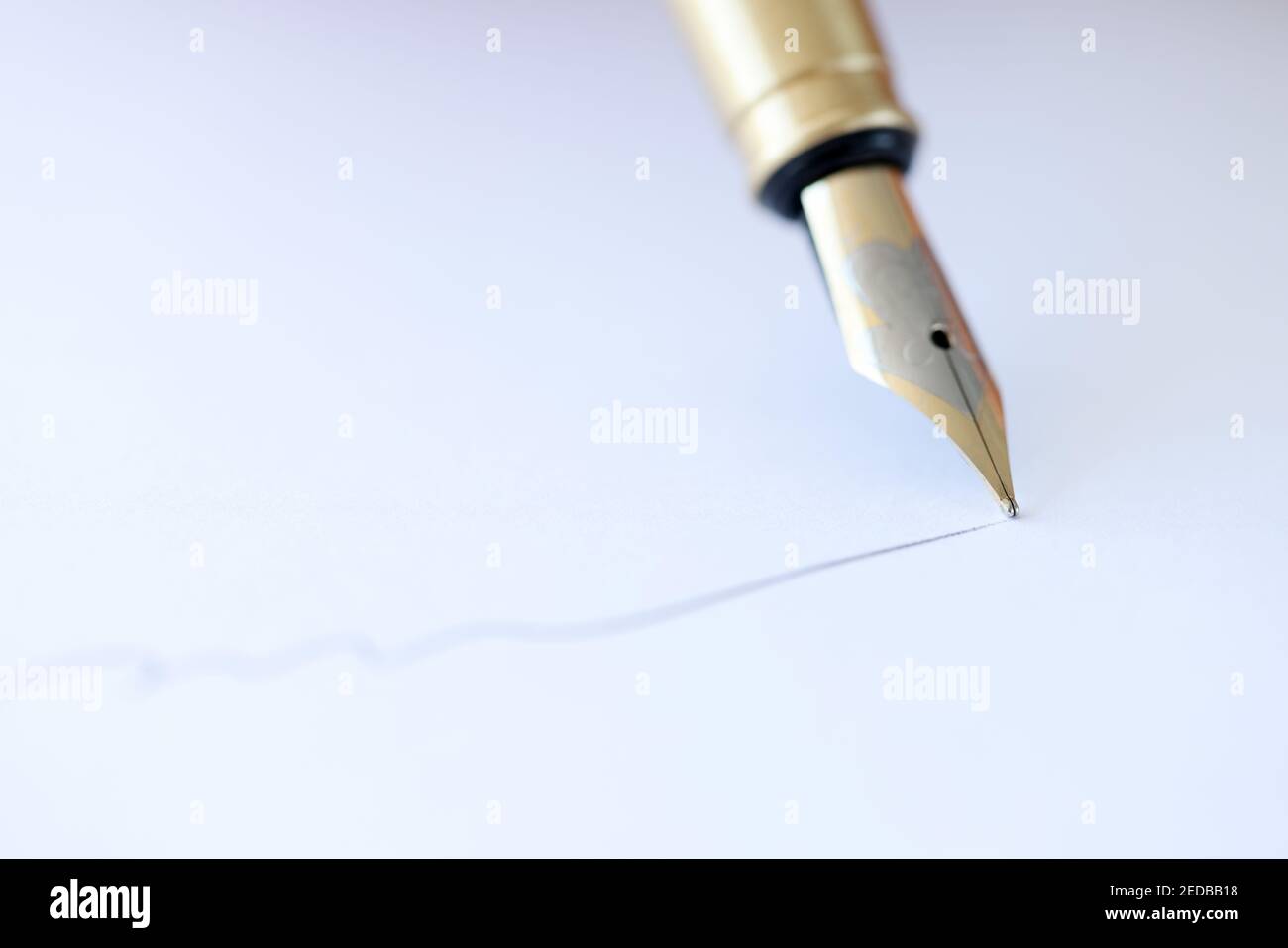 With fountain pen write on white sheet of paper Stock Photo Alamy