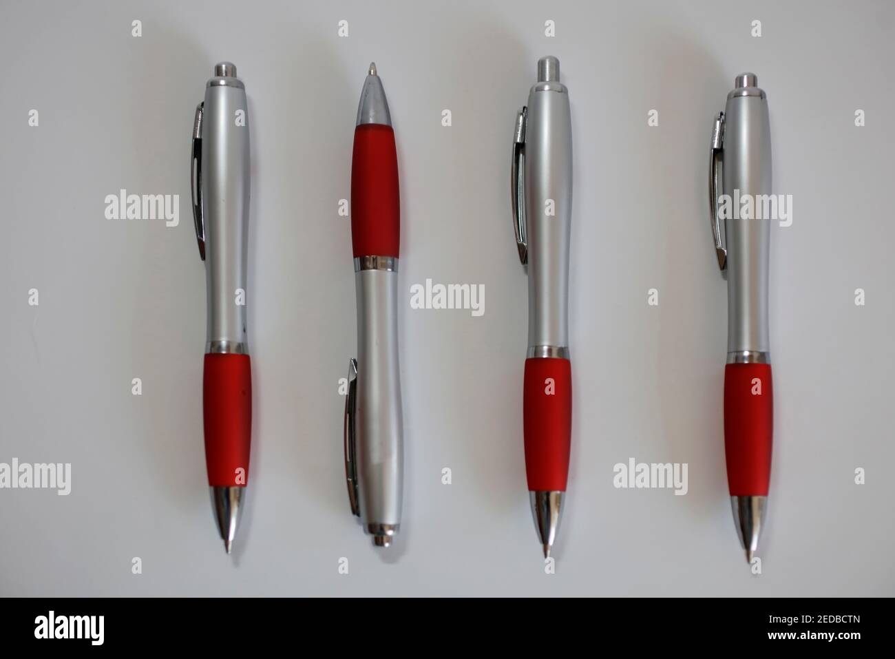 Four pens odd-one-out Stock Photo