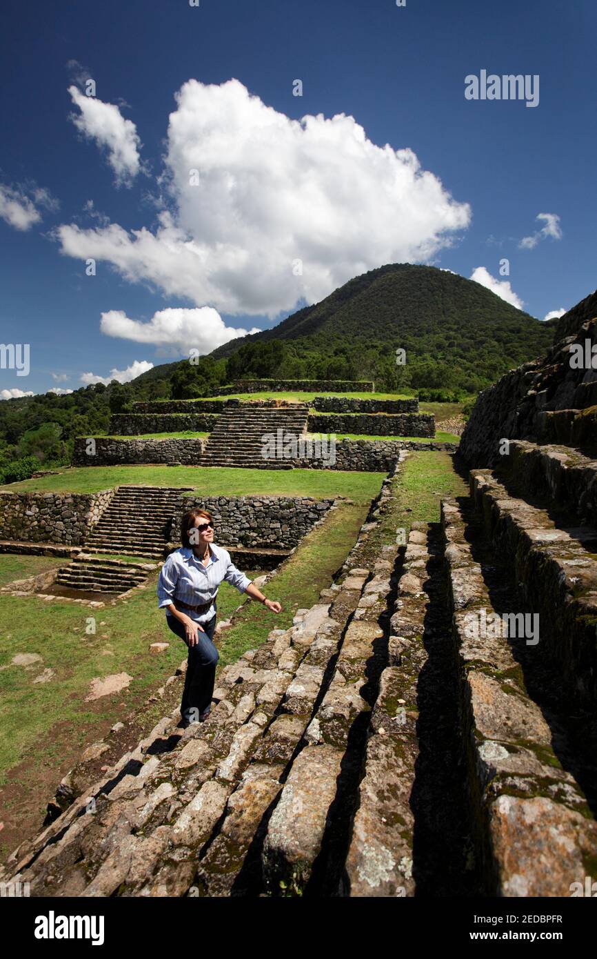 A woman climbs the main pyramid at San Felipe de los Alzati