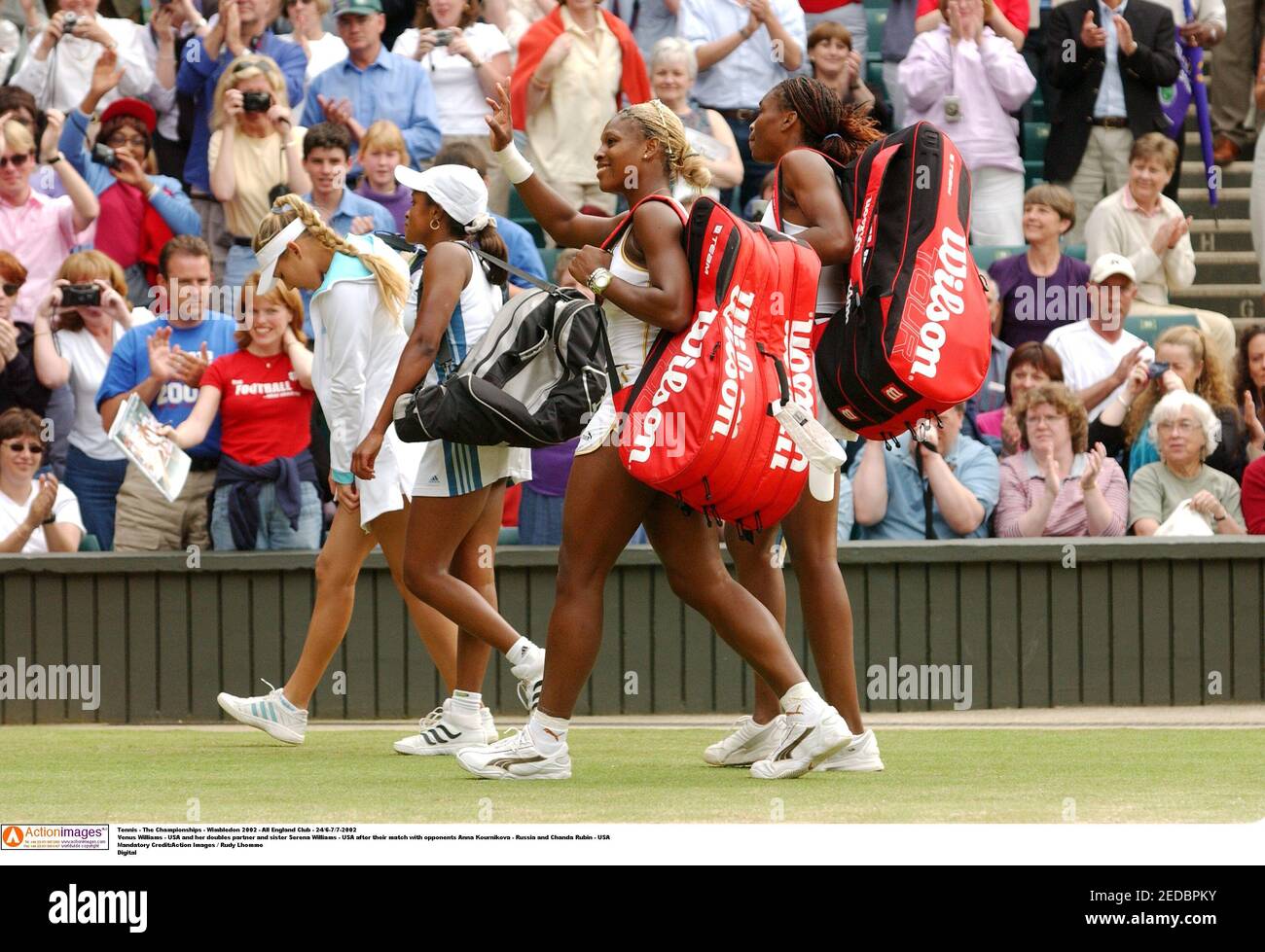 Tennis - The Championships - Wimbledon 2002 - All England Club -  24/6-7/7-2002 Venus Williams - USA and her doubles partner and sister  Serena Williams - USA after their match with opponents