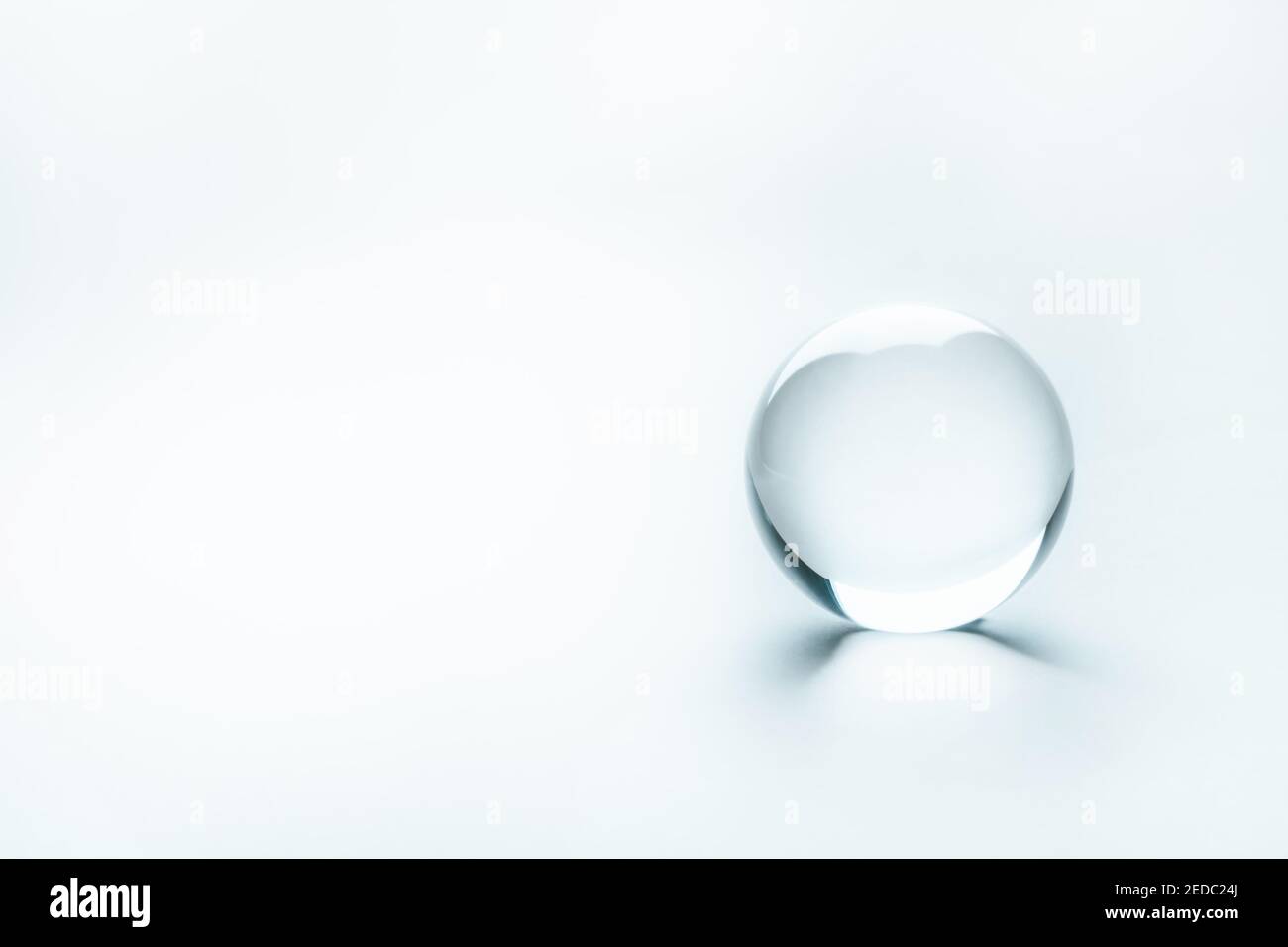 Clear enlighted glass sphere as an idea concept. Minimalistic backdrop for text copy and universal concept utilization Stock Photo