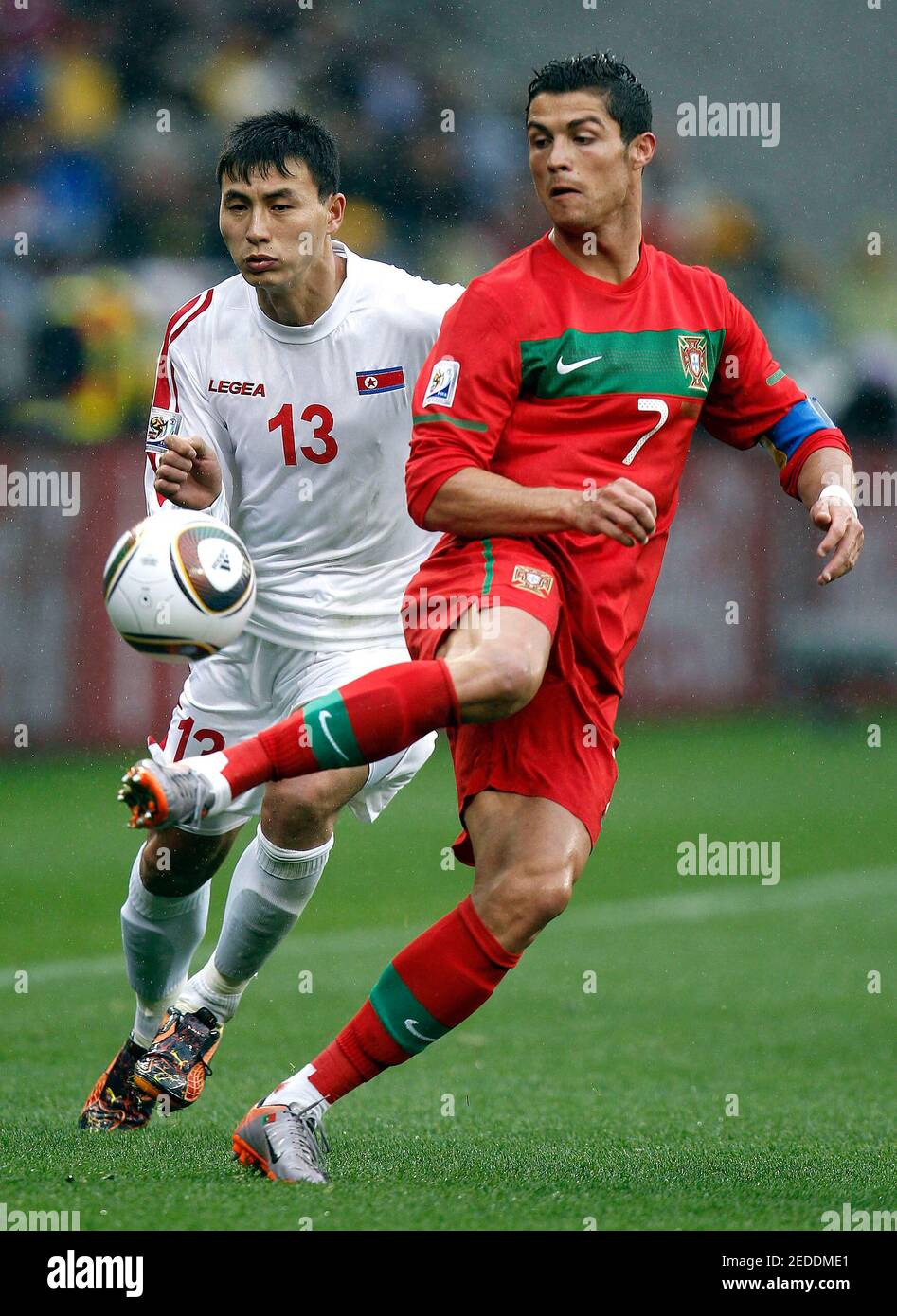 Football - Portugal v North Korea FIFA World Cup South Africa 2010 - Group  G - Green Point Stadium, Cape Town, South Africa - 21/6/10 Portugal's  Cristiano Ronaldo and Chol Jin Pak