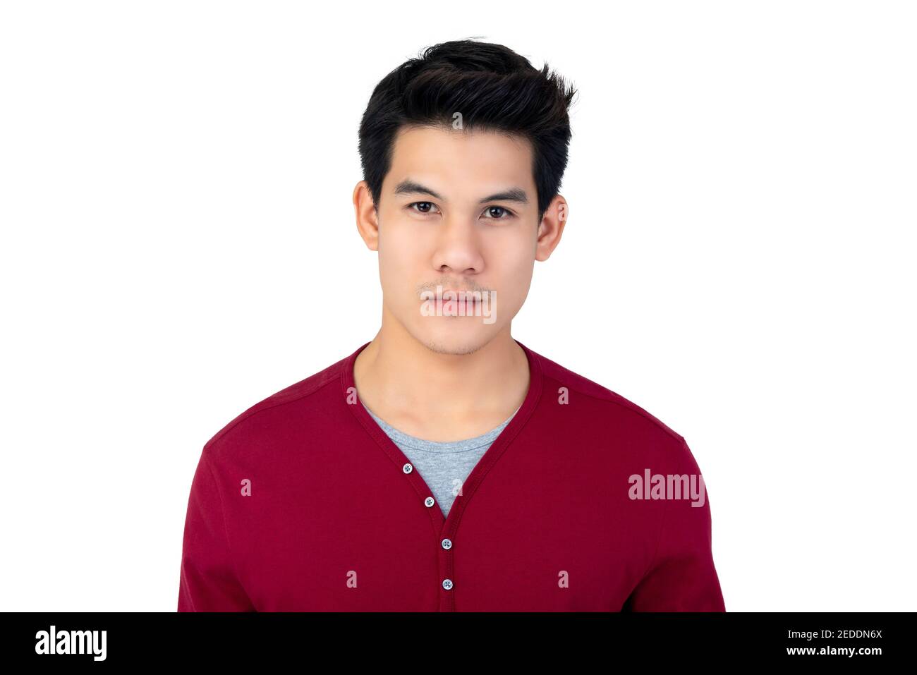Young handsome Thai man face studio shot isolated on white background Stock Photo