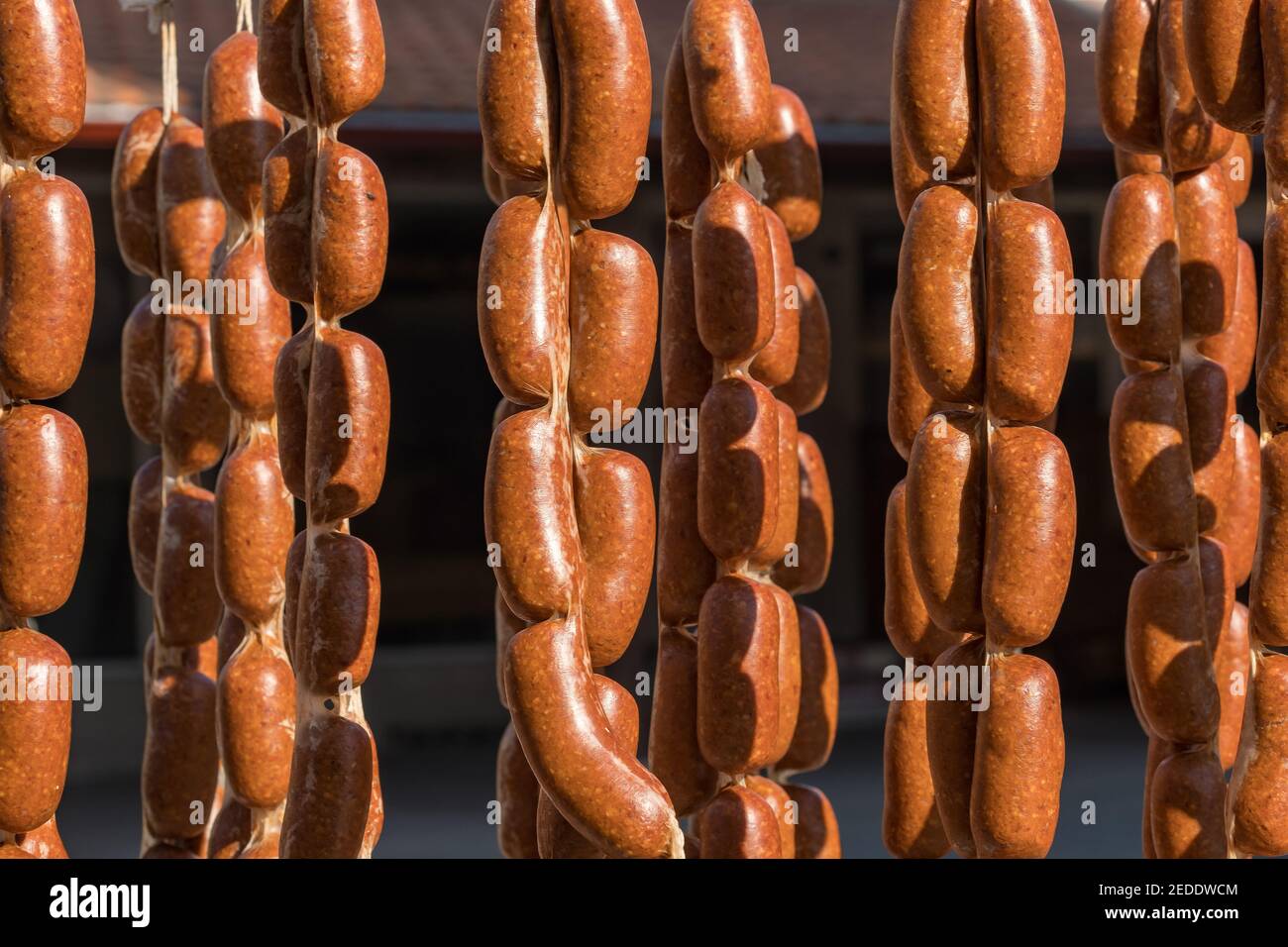 Smoked sausages hangs outdoor next to a butcher's shop to attract buyers in Turkey Stock Photo