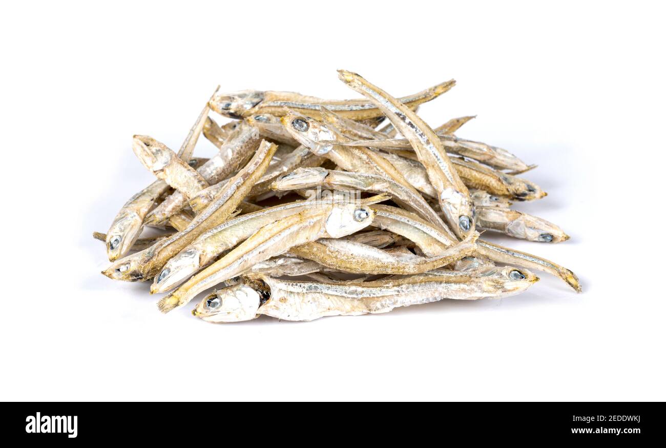 Small salted stockfish or Dried anchovy on white Stock Photo Alamy