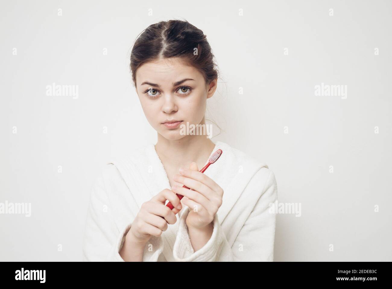 Woman in white coat toothbrush hygiene dental care Stock Photo Alamy