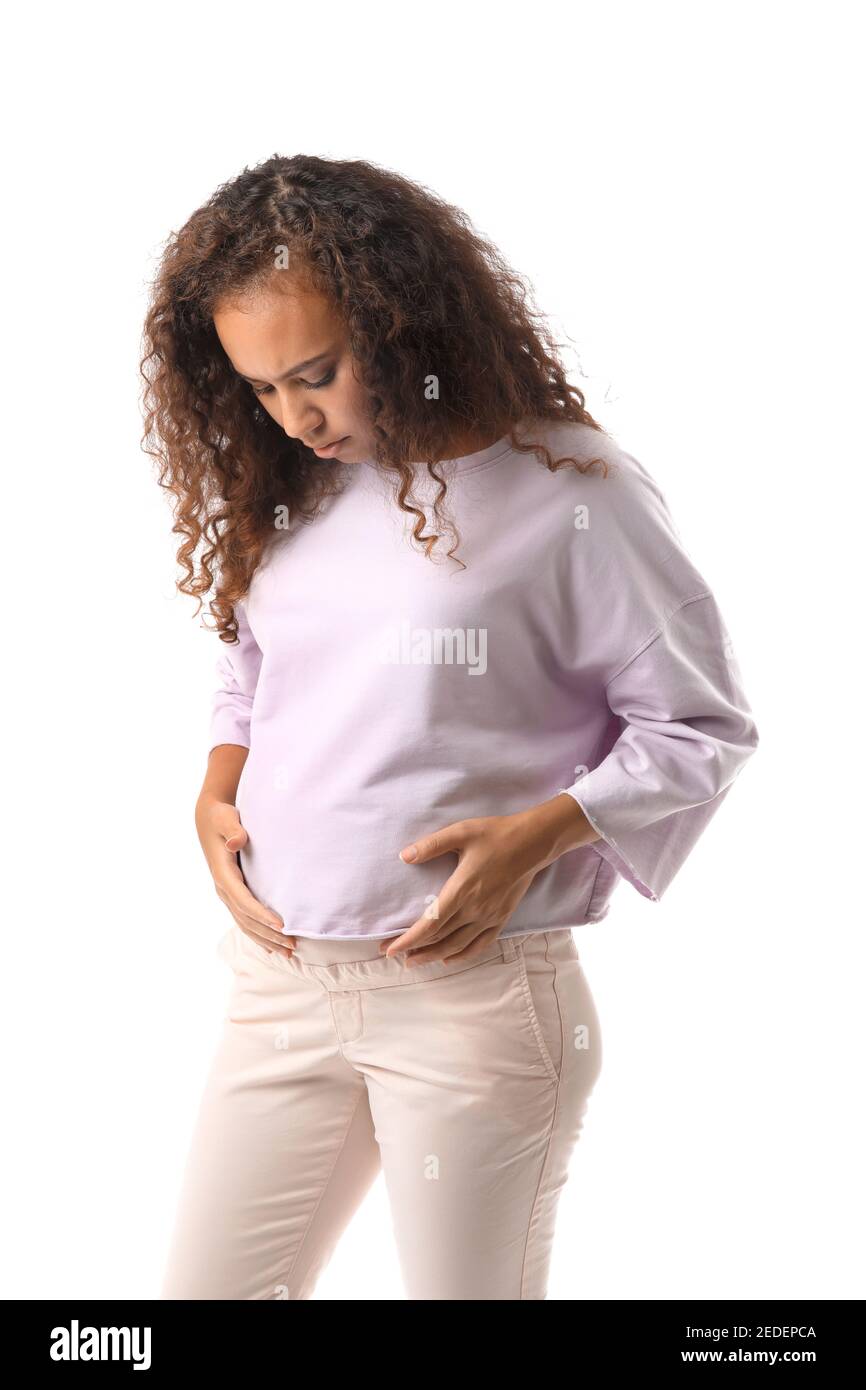 Stressed pregnant African-American woman on white background Stock Photo