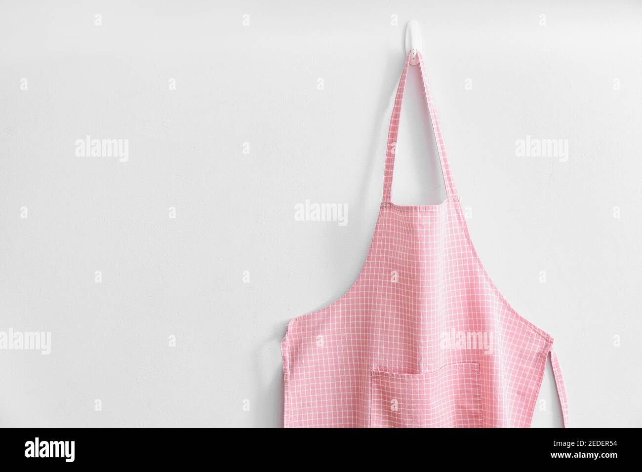 Clean apron on light background Stock Photo - Alamy