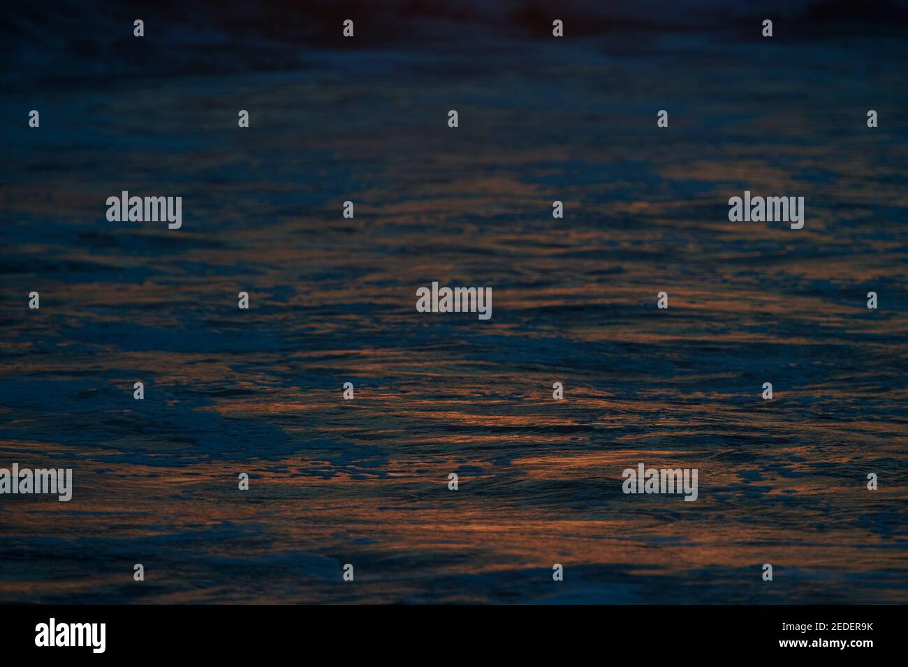 Golden sunlight shimmering on the Pacific Ocean in South America Stock