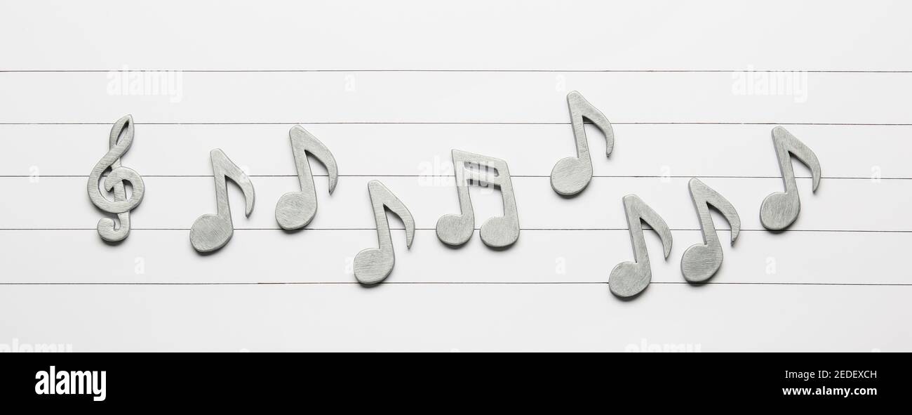 Music notes on light background Stock Photo - Alamy