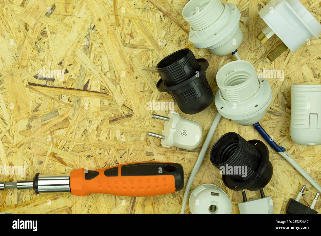 Installation of electrical wiring and connection of sockets and plugs