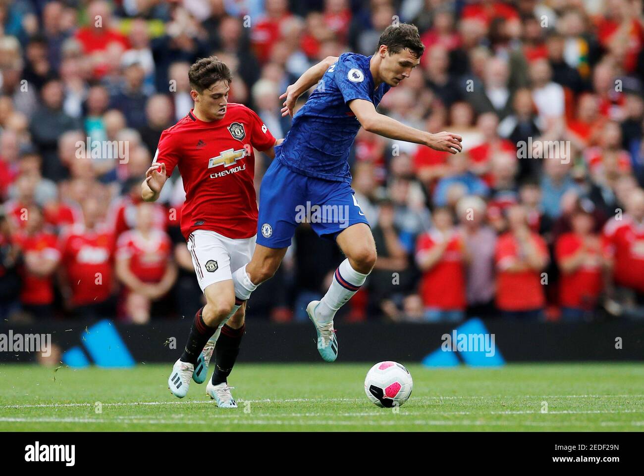 Soccer Football - Premier League - Manchester United v Chelsea - Old Trafford, Manchester, Britain - August 11, 2019  Manchester United's Daniel James in action with Chelsea's Andreas Christensen   REUTERS/Phil Noble  EDITORIAL USE ONLY. No use with unauthorized audio, video, data, fixture lists, club/league logos or 'live' services. Online in-match use limited to 75 images, no video emulation. No use in betting, games or single club/league/player publications.  Please contact your account representative for further details. Stock Photo