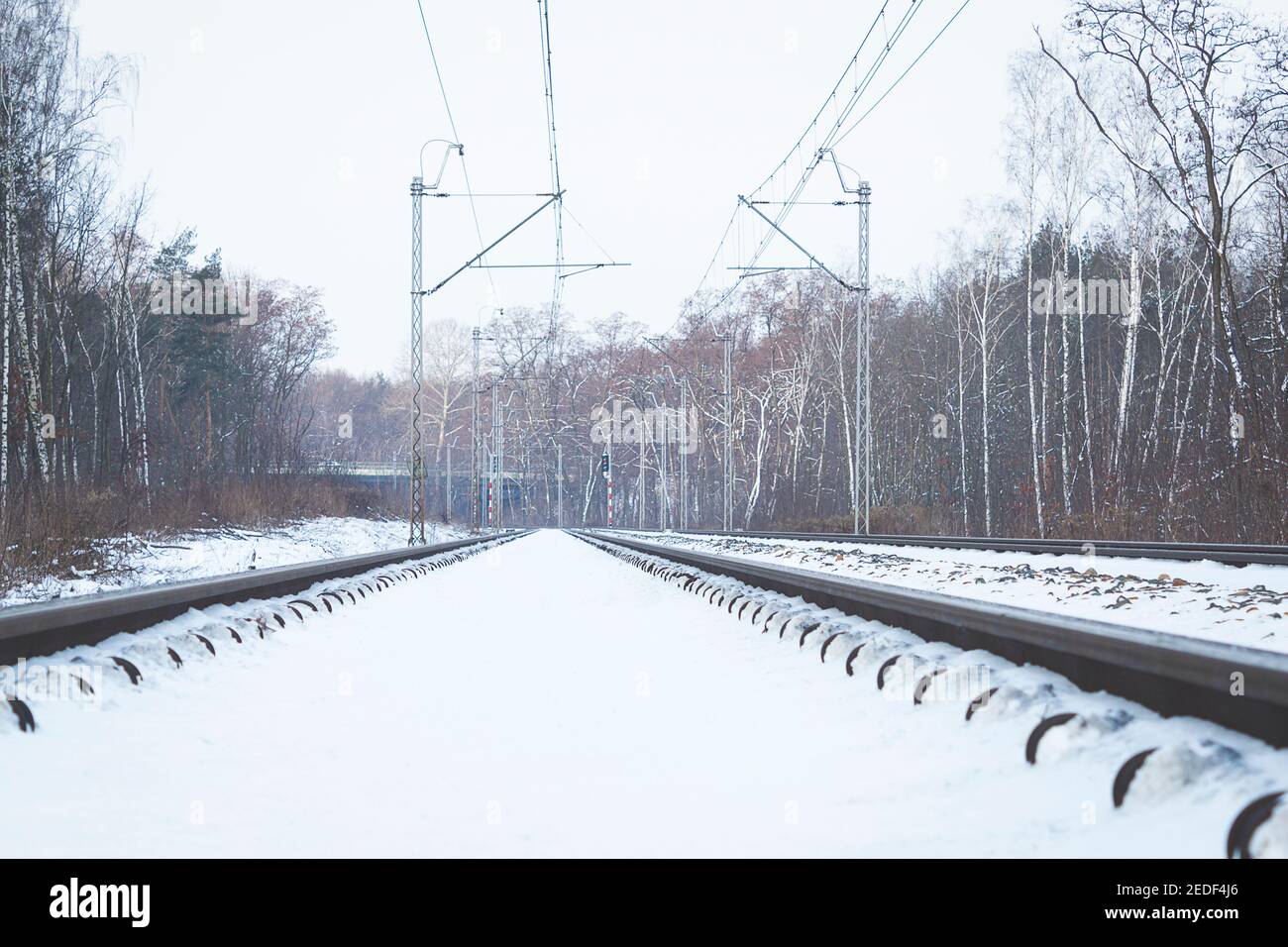 The rails are covered with snow, View along the railway. The rails in ...