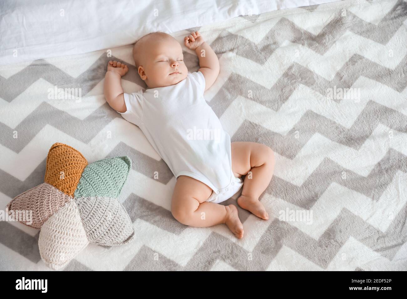 Cute little baby sleeping on bed at home Stock Photo Alamy