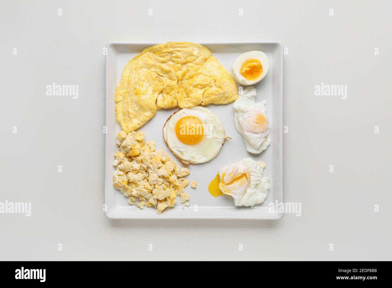 Set of different egg dishes on light background Stock Photo Alamy