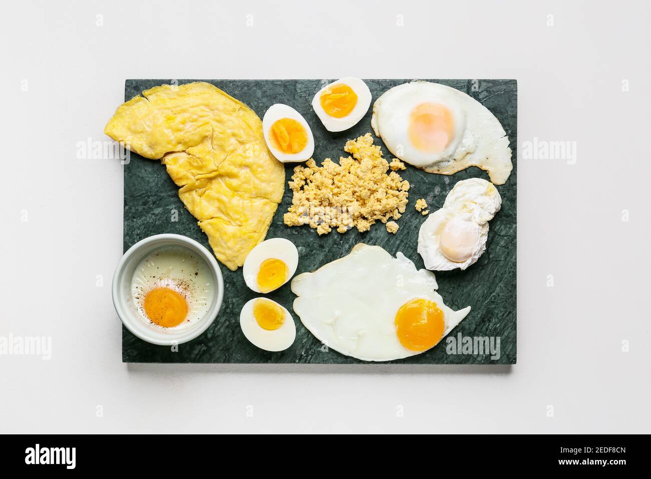 Set of different egg dishes on light background Stock Photo Alamy