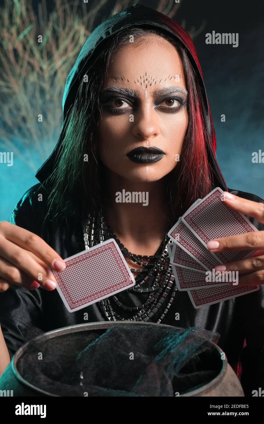 Fortune teller with cards on dark background Stock Photo Alamy