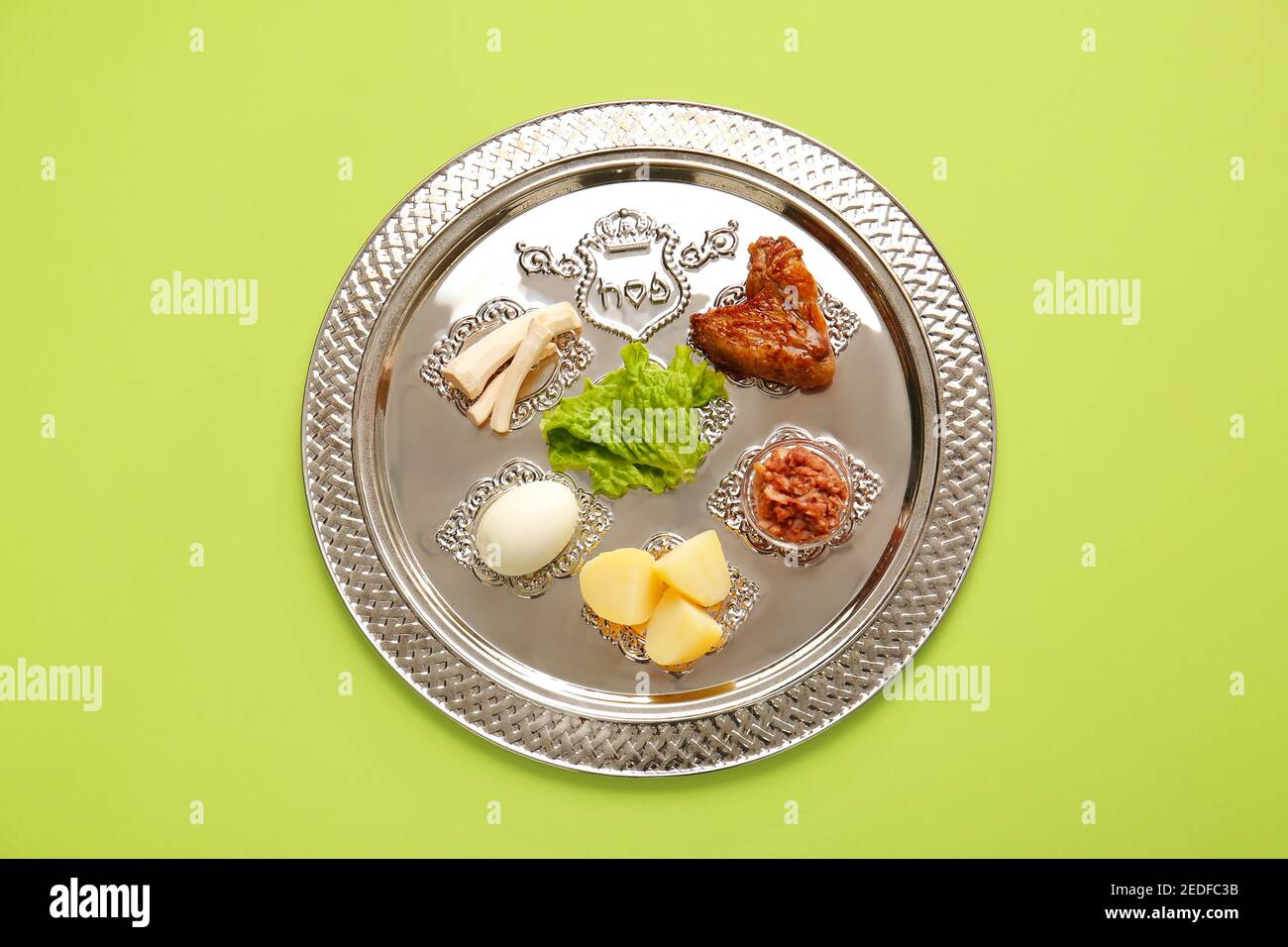 Passover Seder plate with traditional food on color background Stock ...