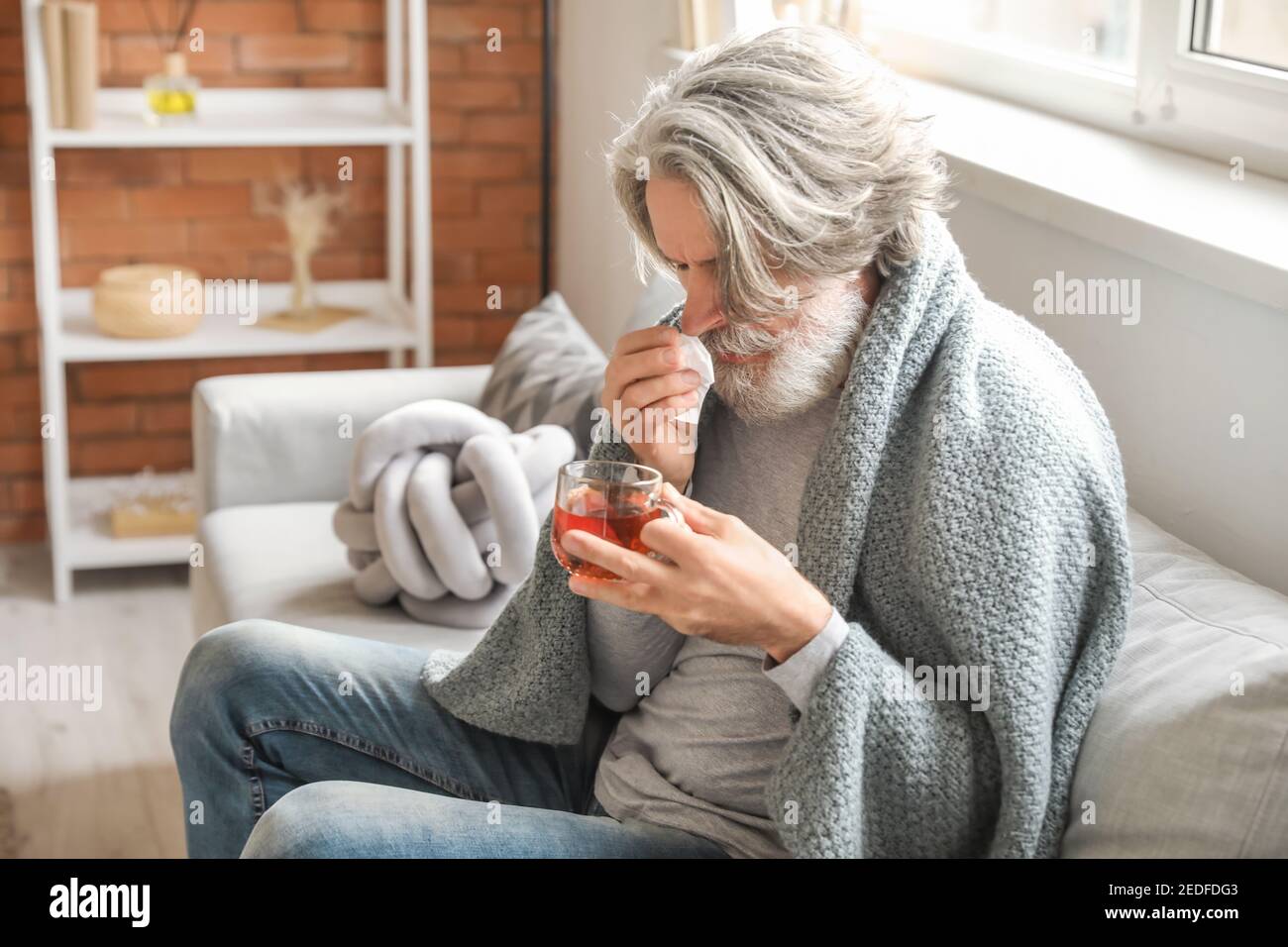 Sick old man coughing sitting hi-res stock photography and images - Alamy