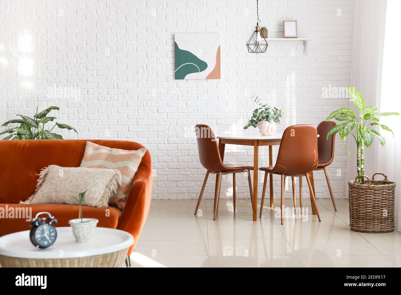 Dining table in interior of living room Stock Photo - Alamy