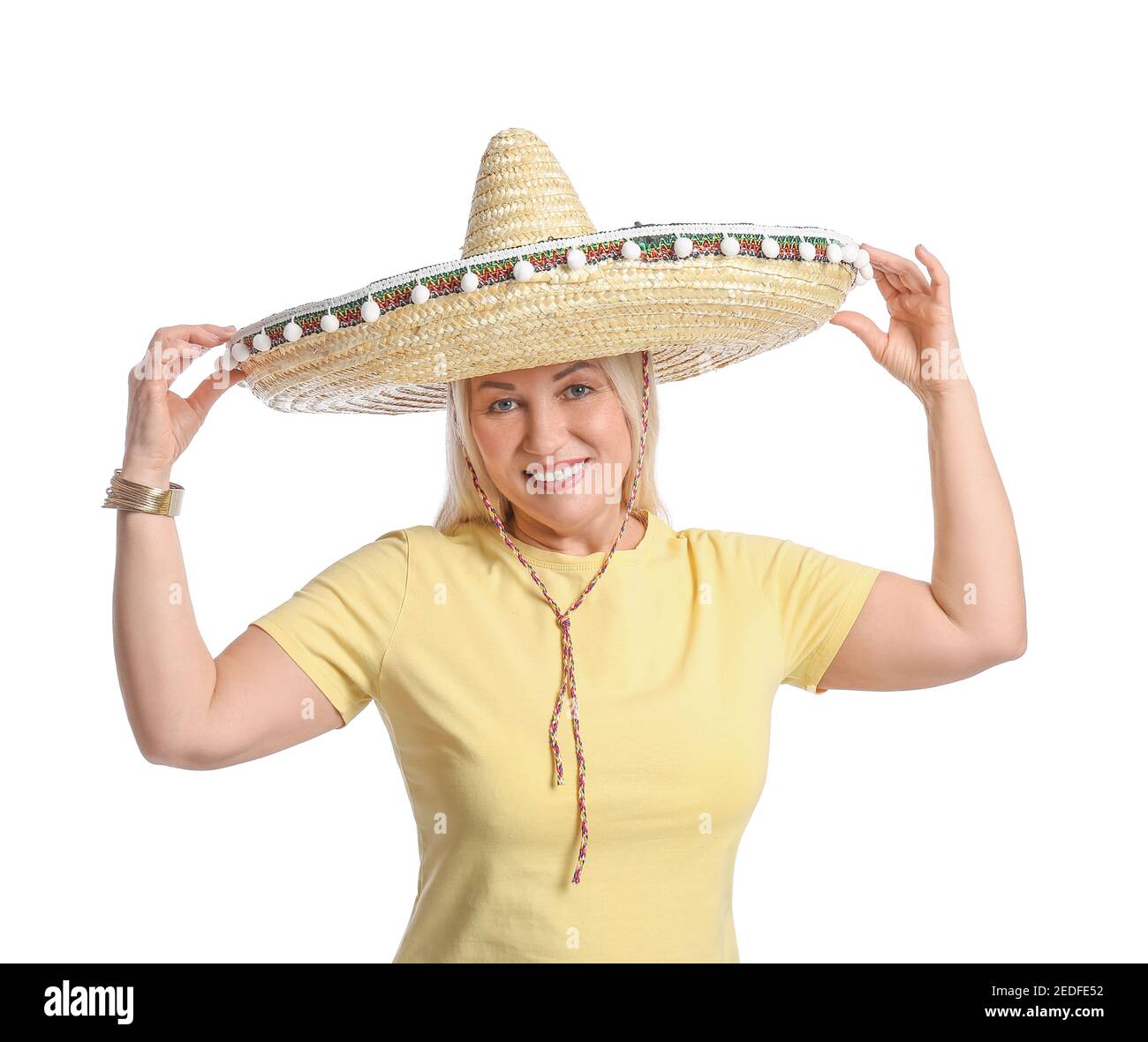 Mature Mexican woman in sombrero hat on white background Stock Photo - Alamy