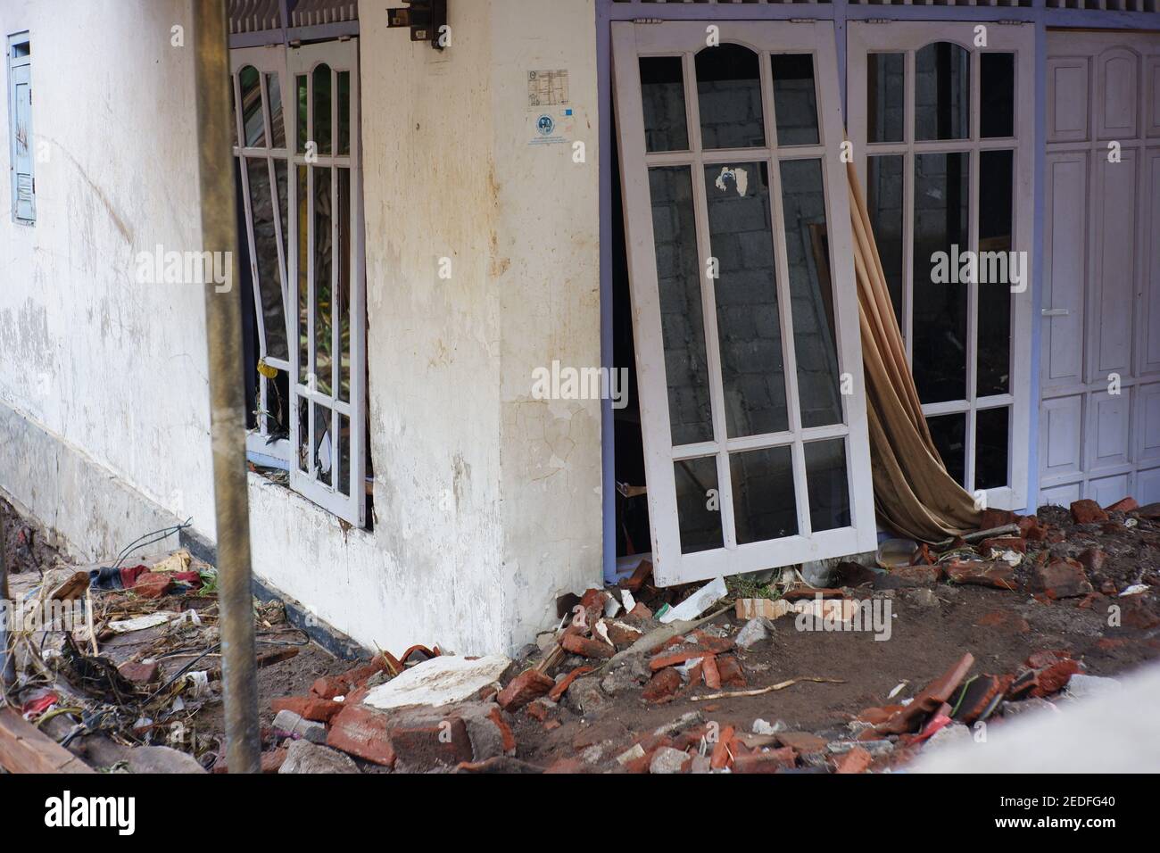 flash floods that destroyed dozens of houses and caused casualties. buildings destroyed after being hit by floods, storms, landslides in the rainy sea Stock Photo