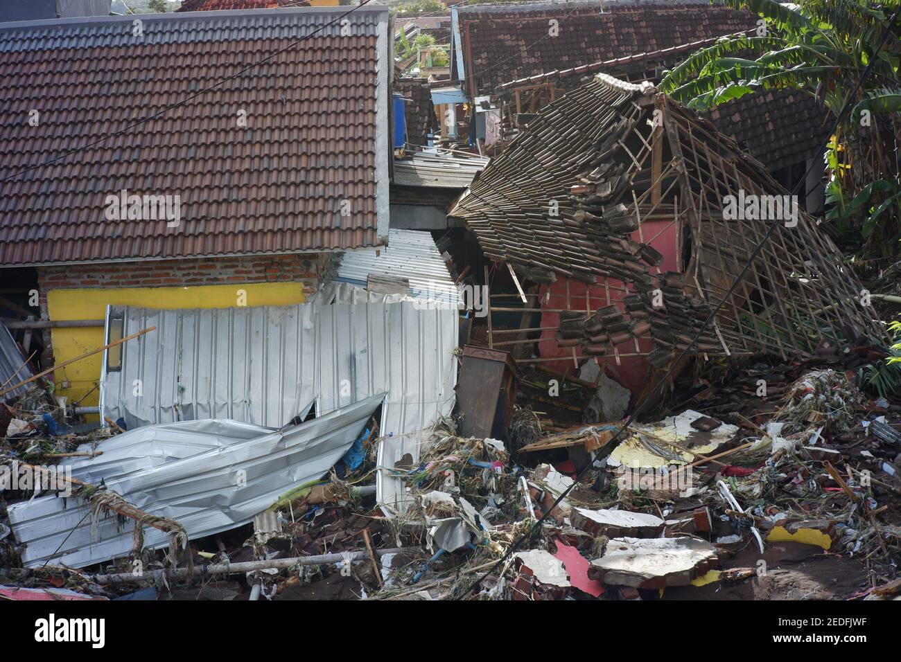 flash floods that destroyed dozens of houses and caused casualties. buildings destroyed after being hit by floods, storms, landslides in the rainy sea Stock Photo