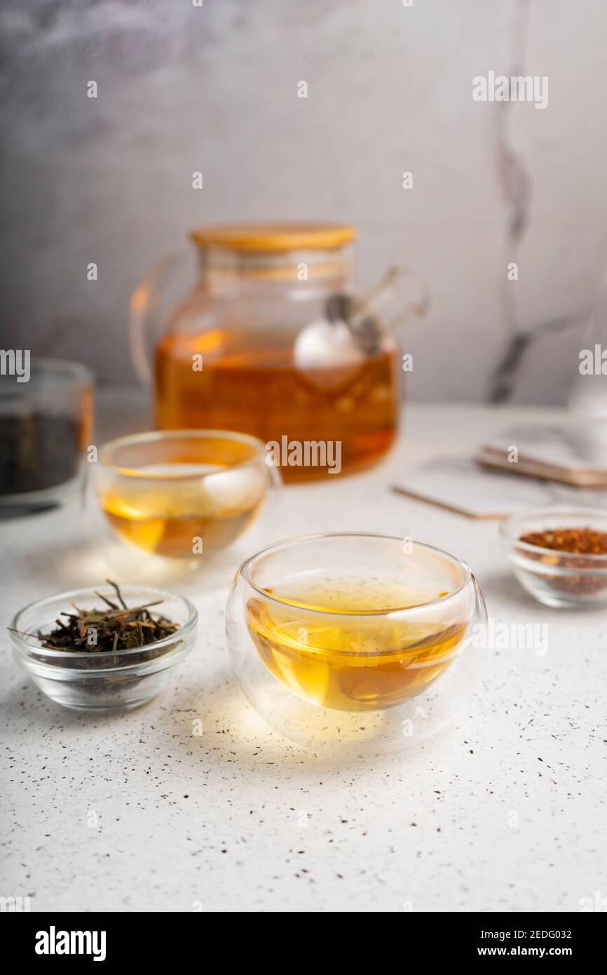 light tea flatley. pour black tea into thermos cups, on a light