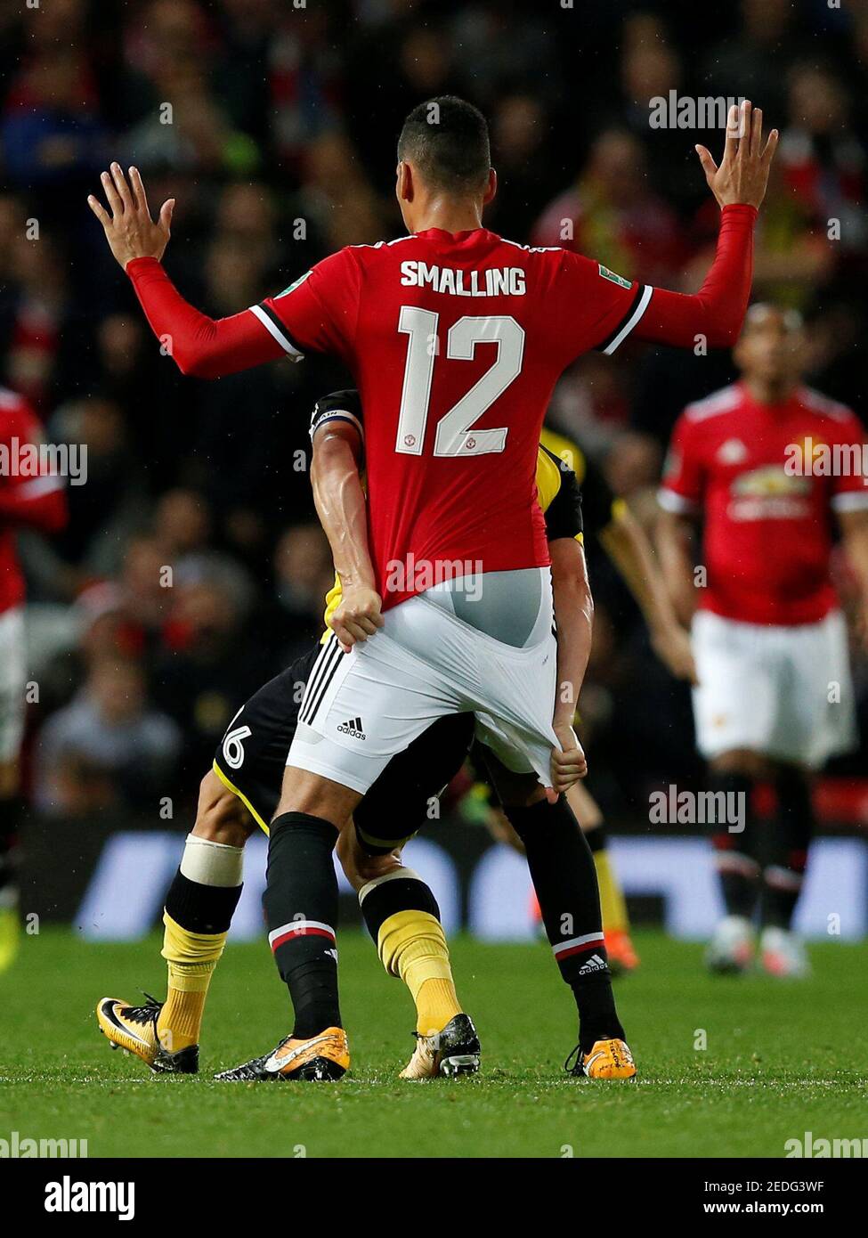 Soccer Football - Carabao Cup Third Round - Manchester United vs Burton  Albion - Old Trafford, Manchester, Britain - September 20, 2017 Manchester  United's Chris Smalling in action with Burton Albion's Luke