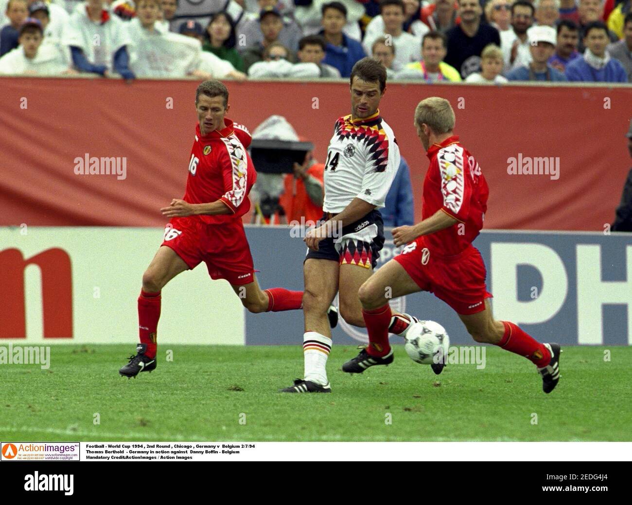 Football - World Cup 1994 , 2nd Round , Chicago , Germany v  Belgium 2/7/94  Thomas Berthold  - Germany in action against  Danny Boffin - Belgium  Mandatory Credit:ActionImages / Action Images Stock Photo