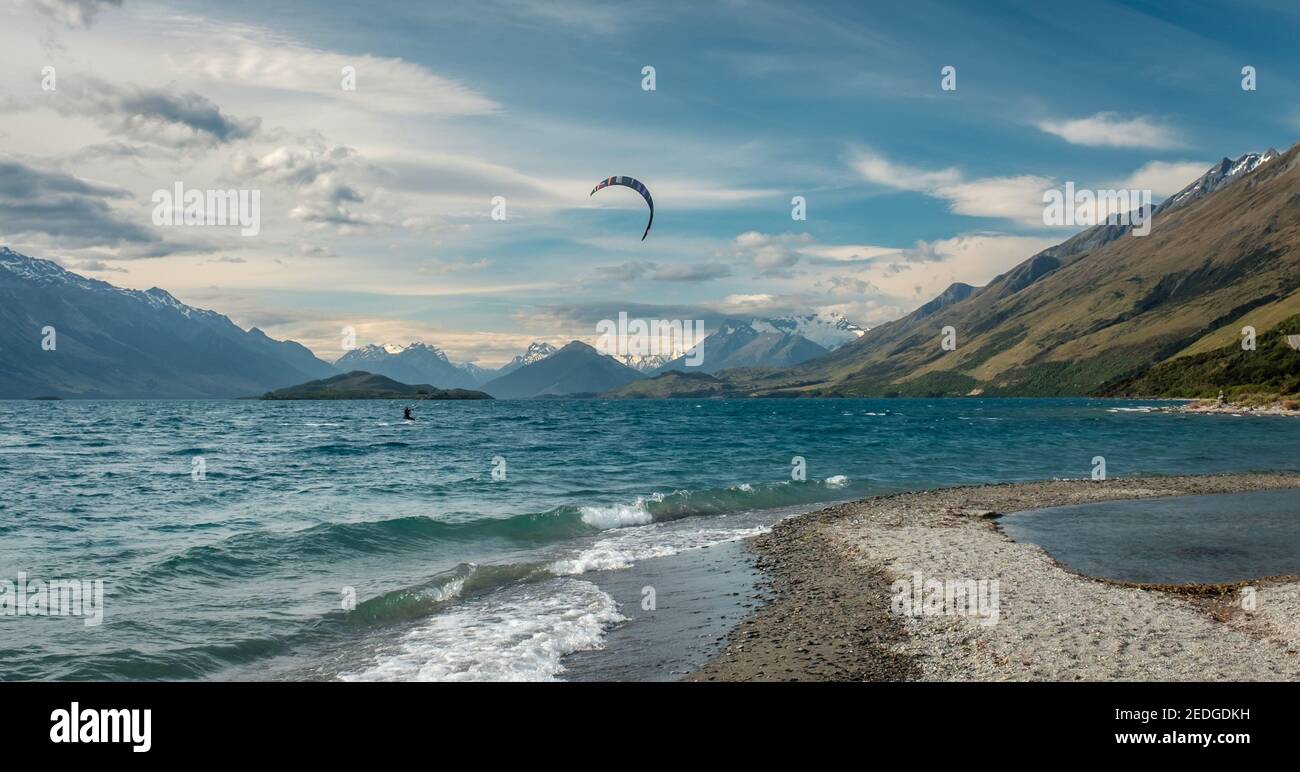 Kite surfer on Lake Wakatipu in New Zealand between Queenstown and Glenorchy. Stock Photo