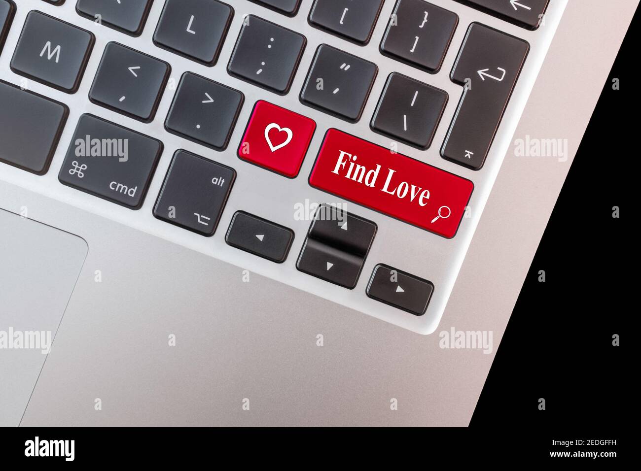 Computer key with love shape and the words find love. Stock Photo