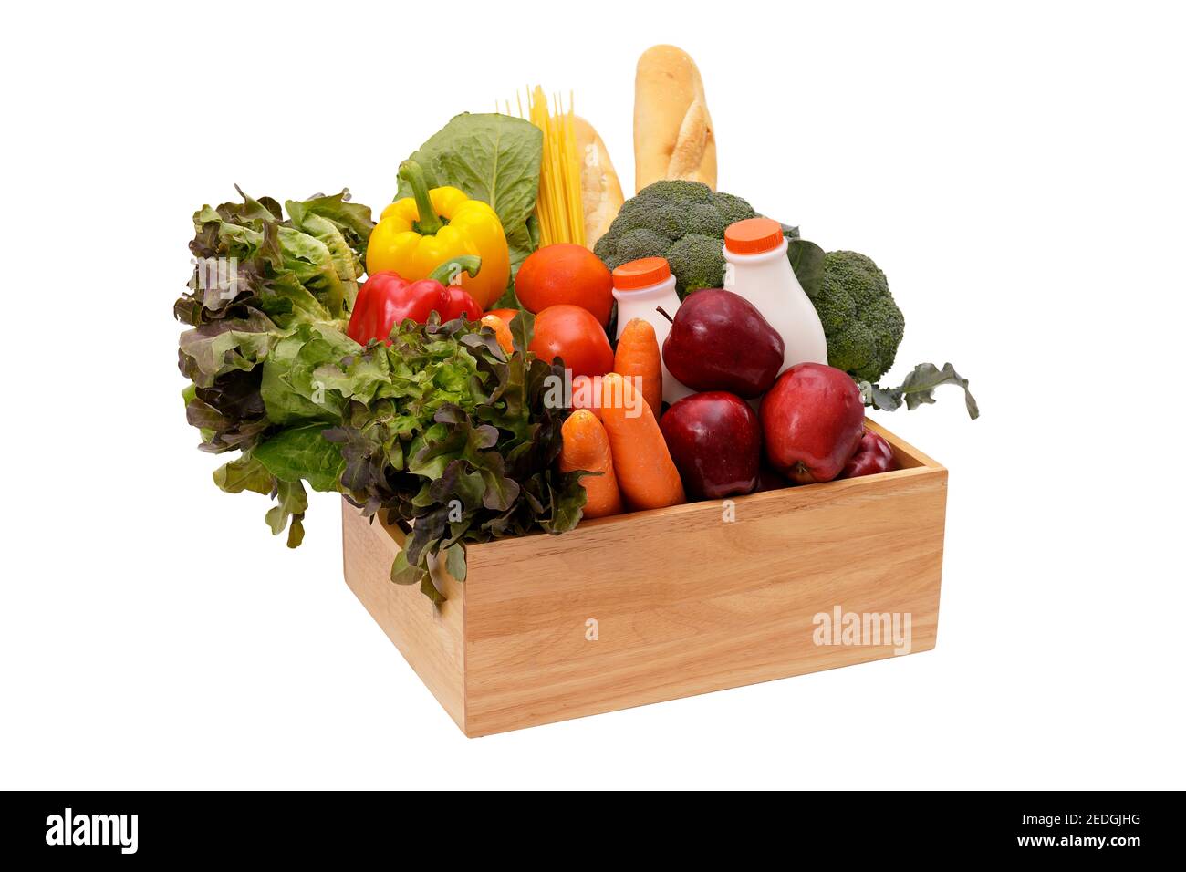 Wooden crate with multi collor vegetables , fruit, milk and baguette isolated on white background. Grocery in wood crate . Save with clipping path Stock Photo