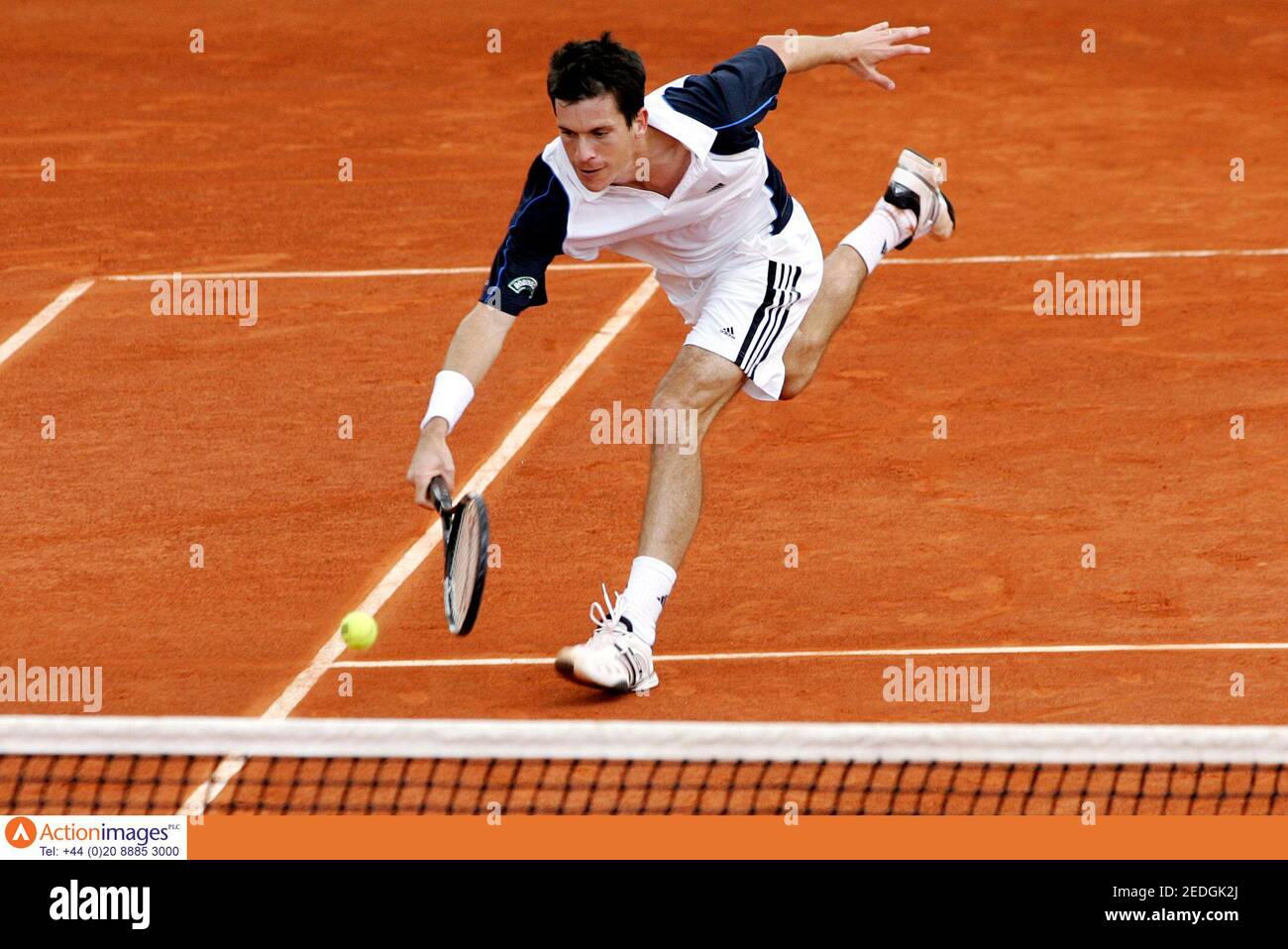 Tennis - French Open - Stade Roland Garros - 23/5/05  Great Britain's Tim Henman lunges for a shot during his match against Juan Pablo Brzezicki of Argentina    Mandatory Credit: Action Images / Jason O'Brien  Livepic Stock Photo