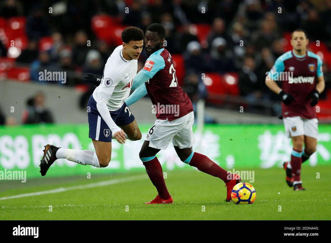 Soccer Football - Premier League - Tottenham Hotspur vs West Ham United - Wembley Stadium, London, Britain - January 4, 2018   Tottenham's Dele Alli in action with West Ham United's Arthur Masuaku    REUTERS/Eddie Keogh    EDITORIAL USE ONLY. No use with unauthorized audio, video, data, fixture lists, club/league logos or 'live' services. Online in-match use limited to 75 images, no video emulation. No use in betting, games or single club/league/player publications.  Please contact your account representative for further details. Stock Photo