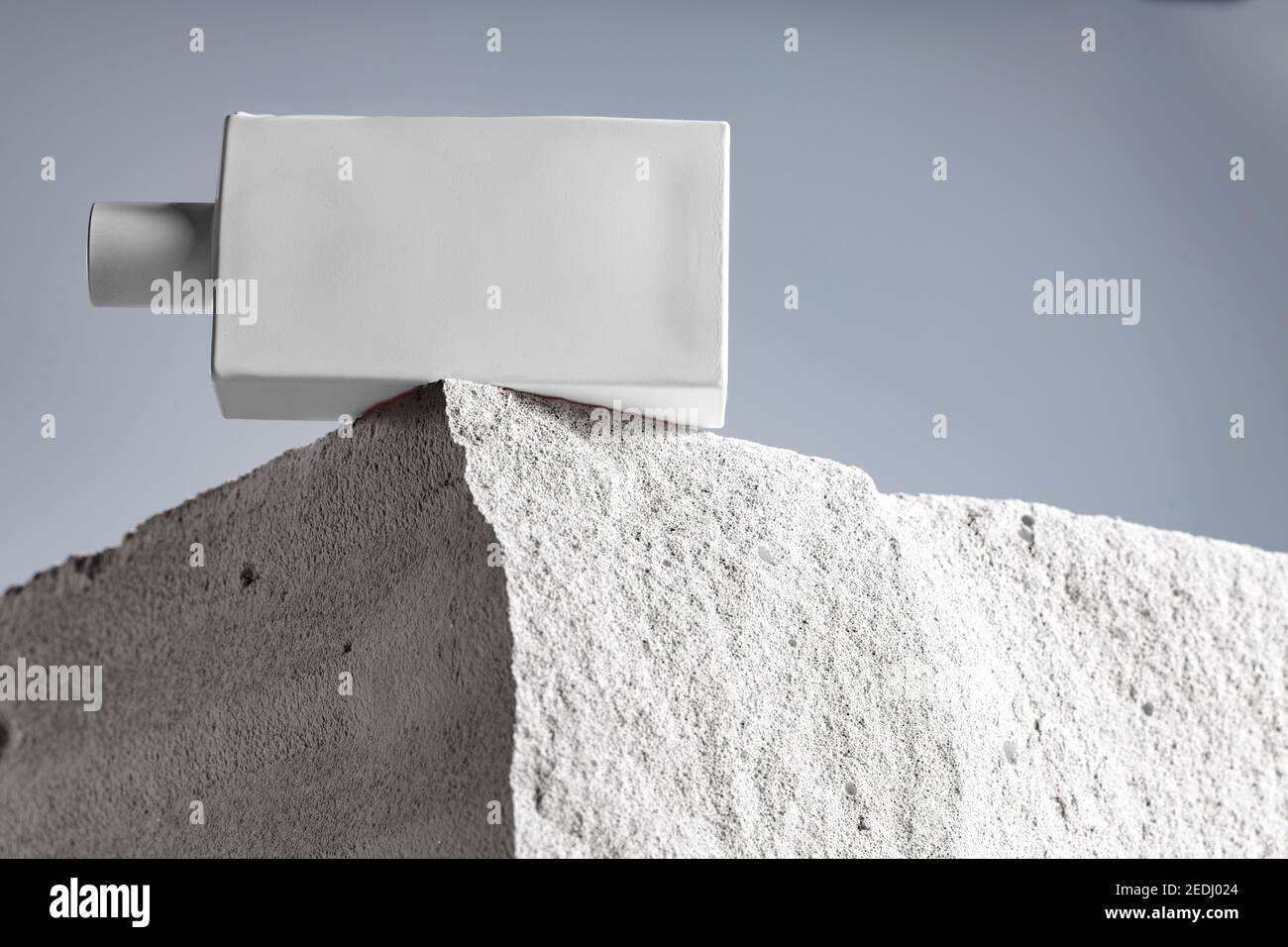 Bottle of perfume on cinder block close up Stock Photo Alamy