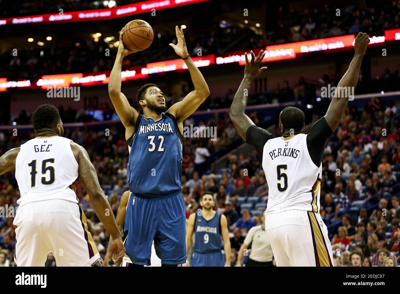 Feb 27, 2016; New Orleans, LA, USA; Minnesota Timberwolves center Karl-Anthony Towns (32) shoots over New Orleans Pelicans center Kendrick Perkins (5) during the first half of a game at  the Smoothie King Center. Mandatory Credit: Derick E. Hingle-USA TODAY Sports  / Reuters  Picture Supplied by Action Images   (TAGS: Sport Basketball NBA) *** Local Caption *** 2016-02-28T013144Z 1495680546 NOCID RTRMADP 3 NBA-MINNESOTA-TIMBERWOLVES-AT-NEW-ORLEANS-PELICANS.JPG Stock Photo