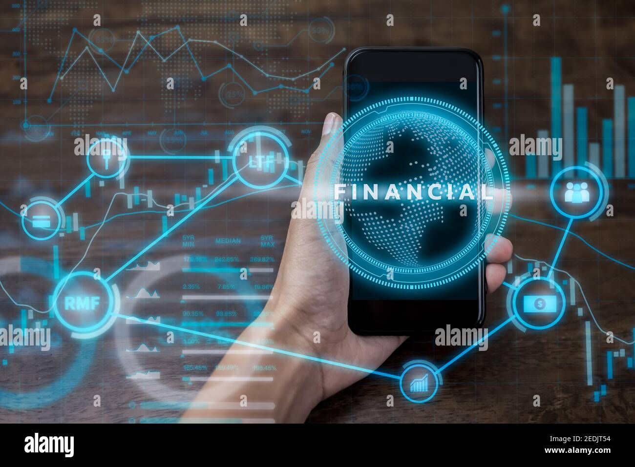 Hand holding smartphone with  futuristic online financial and investment technology digital data display, fintech concept Stock Photo