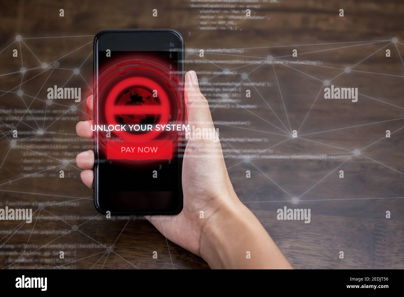 Hand holding smartphone that the system being locked by ransomware cyber attack Stock Photo